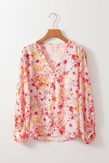 Roze blouse met bloemenprint en V-hals