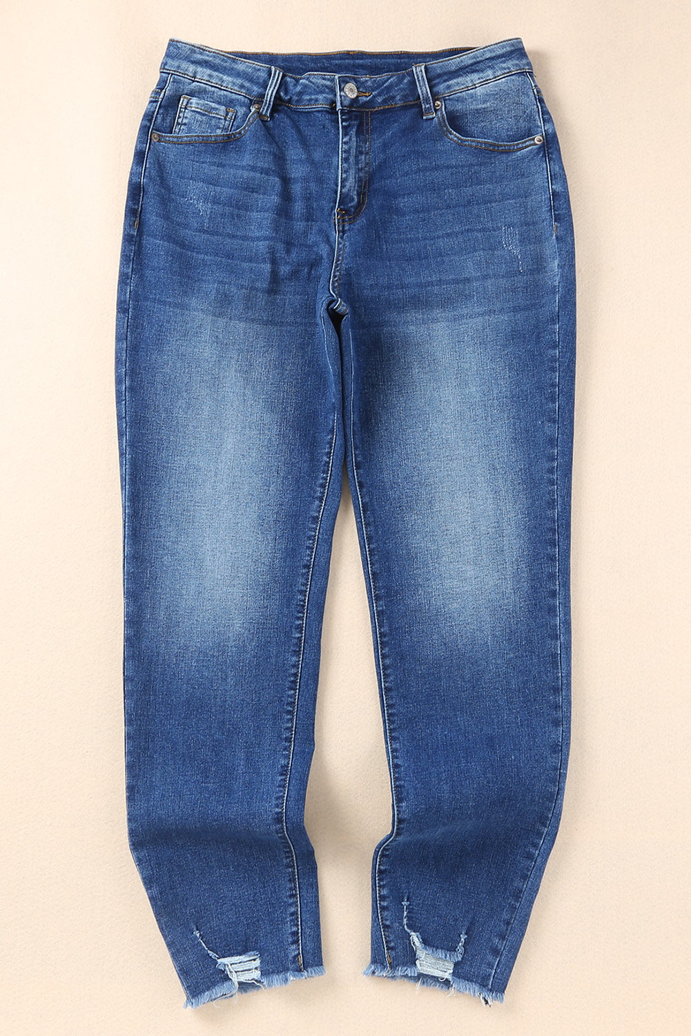 Blauwe skinny jeans met ruwe zoom tot op de enkel