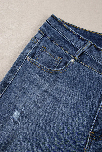 Hemelsblauwe jeans met hoge taille en gescheurde knopen