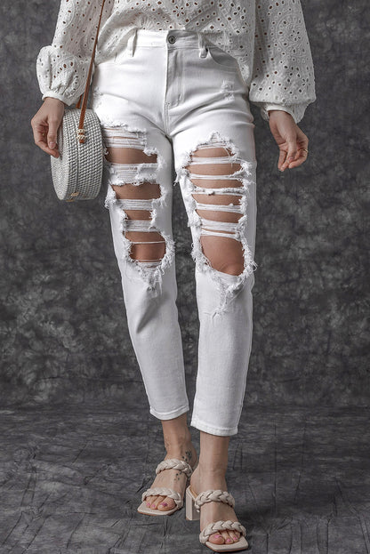 Witte gescheurde jeans met hoge taille en scheuren