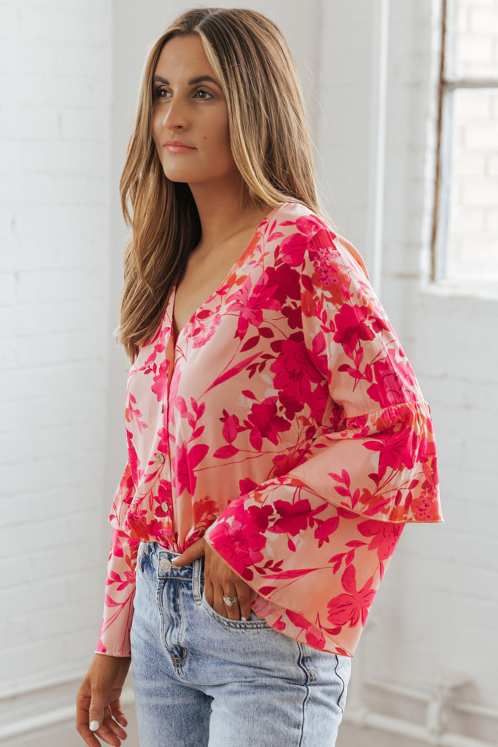 Roze bloemenprint gelaagde bel lange mouwen geknoopt bodysuit