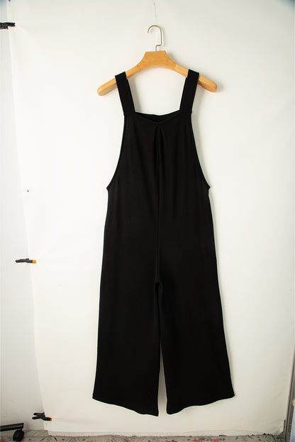 Zwarte jumpsuit met wijde pijpen en geknoopte bandjes