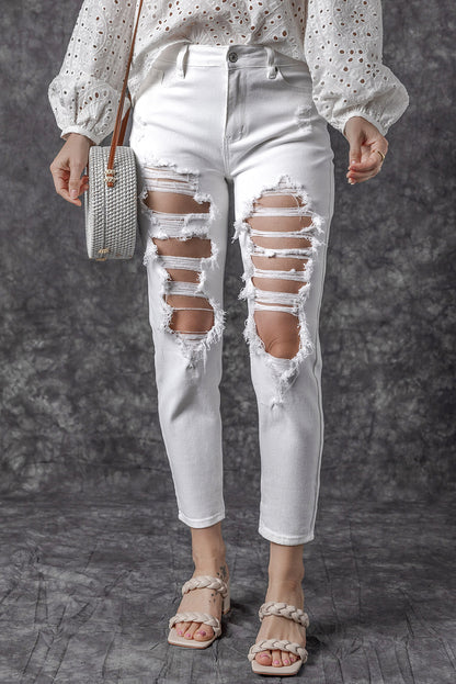 Witte gescheurde jeans met hoge taille en scheuren