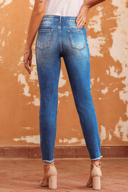 Blauwe skinny jeans met ruwe zoom tot op de enkel