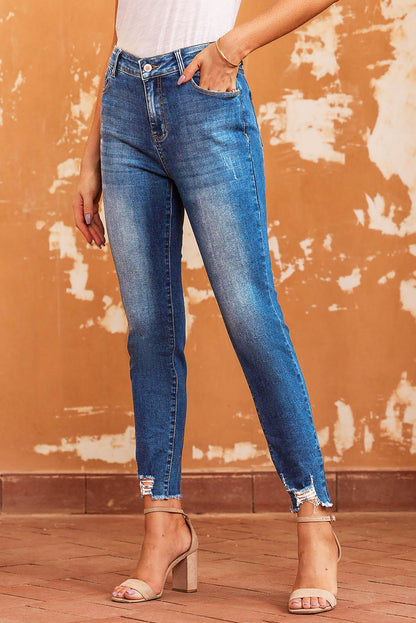 Blauwe skinny jeans met ruwe zoom tot op de enkel