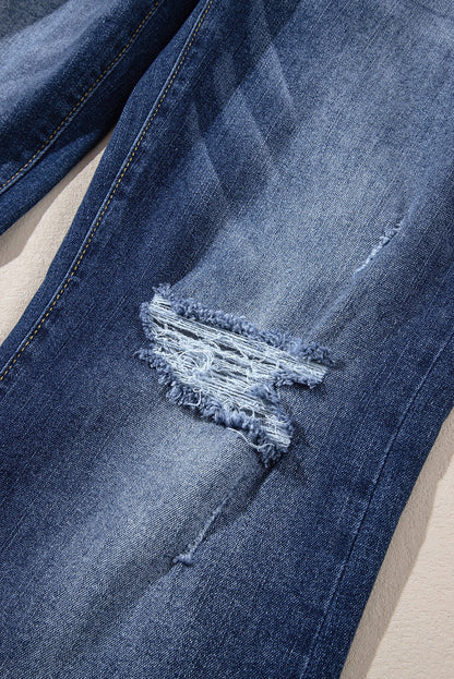 Hemelsblauwe jeans met hoge taille en gescheurde knopen