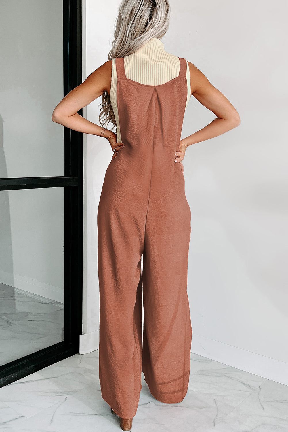 Zwarte jumpsuit met wijde pijpen en geknoopte bandjes