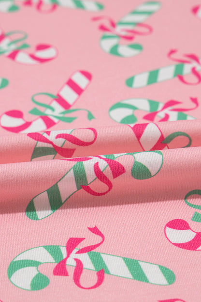 Roze kerstpyjamaset met knoop en zakmotief in zuurstokprint