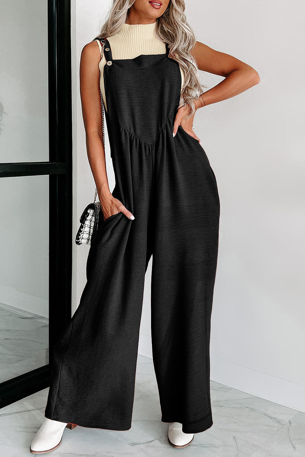 Zwarte jumpsuit met wijde pijpen en geknoopte bandjes