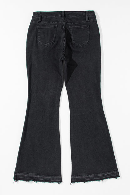 Zwarte jeans met hoge taille en knopen aan de voorkant en flared pijpen