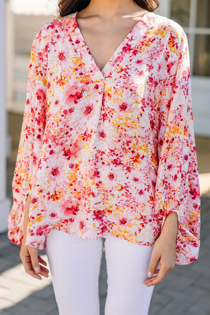 Roze blouse met bloemenprint en V-hals