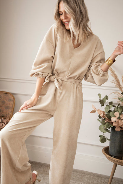 Abrikoos sleutelgat rug V-hals strik taille losse jumpsuit