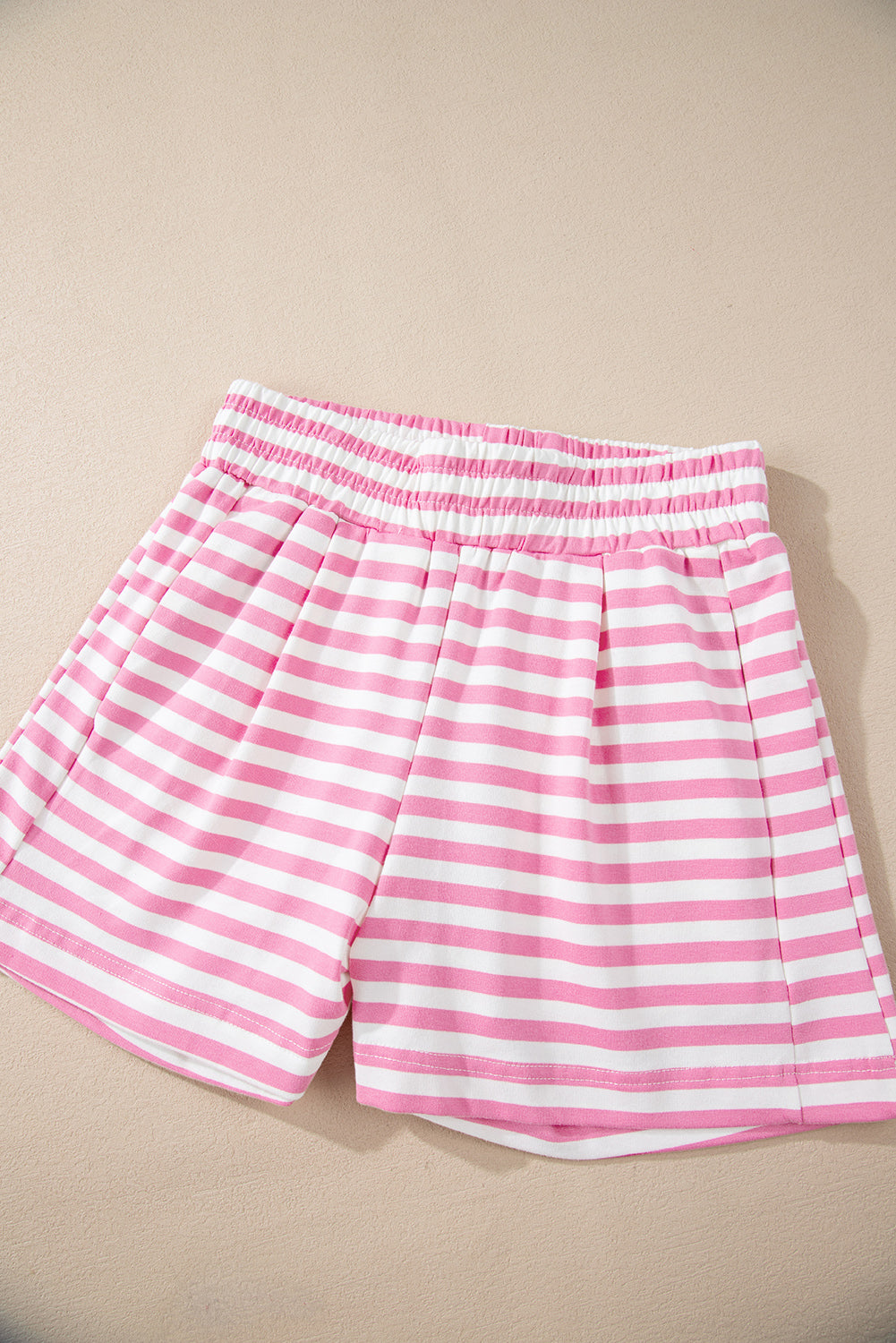 Roze gestreepte kangoeroezak hoodie en wijde pijpen shorts set