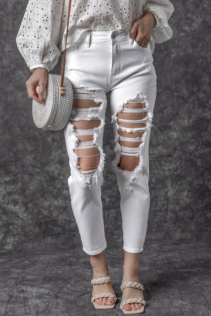 Witte gescheurde jeans met hoge taille en scheuren