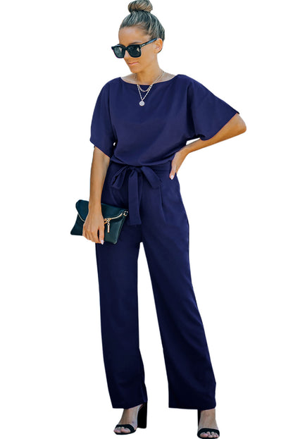 Blauwe jumpsuit met wijde pijpen en riem