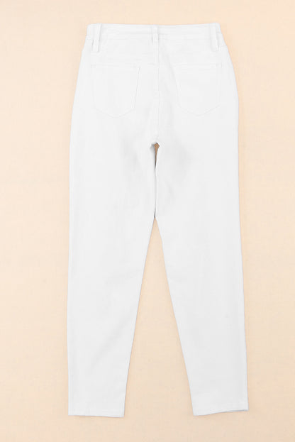 Witte gescheurde jeans met hoge taille en scheuren