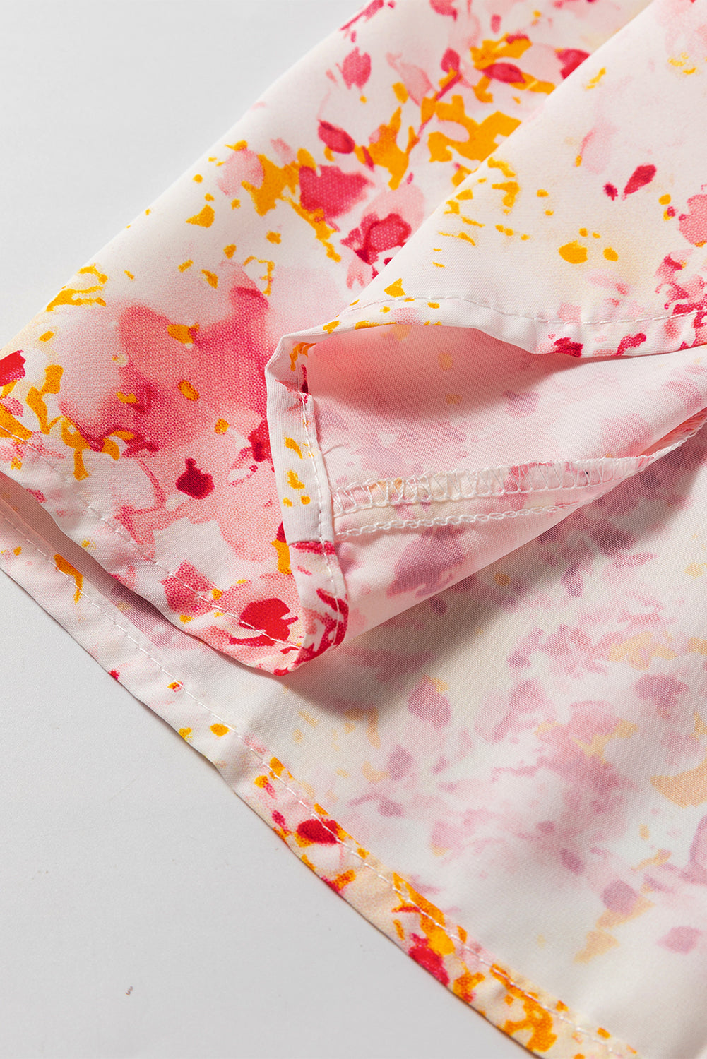 Roze blouse met bloemenprint en V-hals