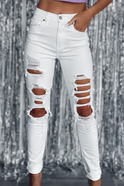 Witte gescheurde jeans met hoge taille en scheuren