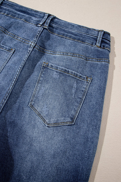 Hemelsblauwe jeans met hoge taille en gescheurde knopen