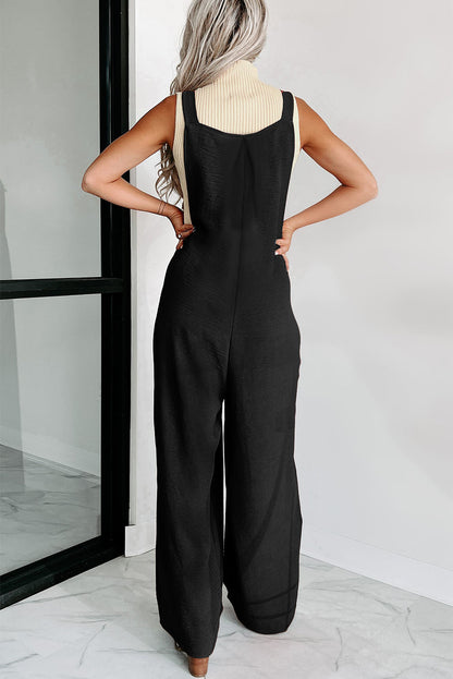 Zwarte jumpsuit met wijde pijpen en geknoopte bandjes