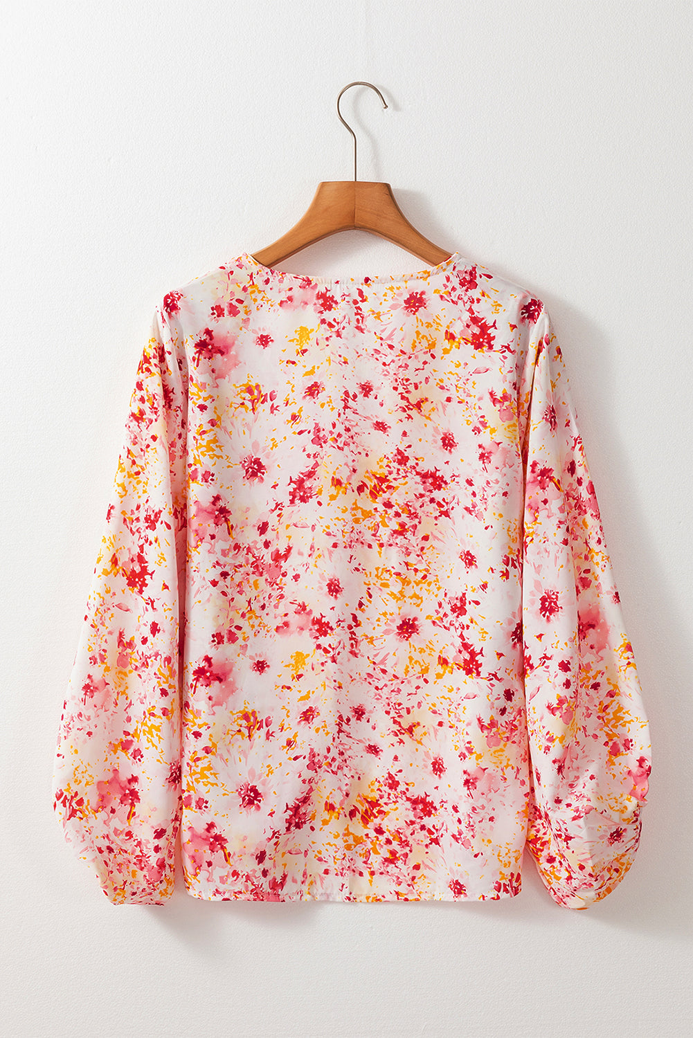 Roze blouse met bloemenprint en V-hals