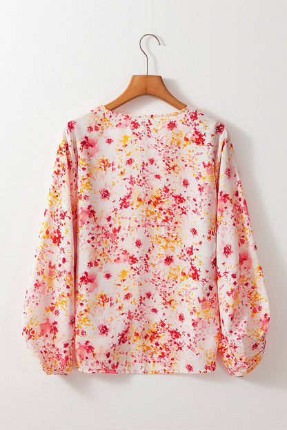 Roze blouse met bloemenprint en V-hals