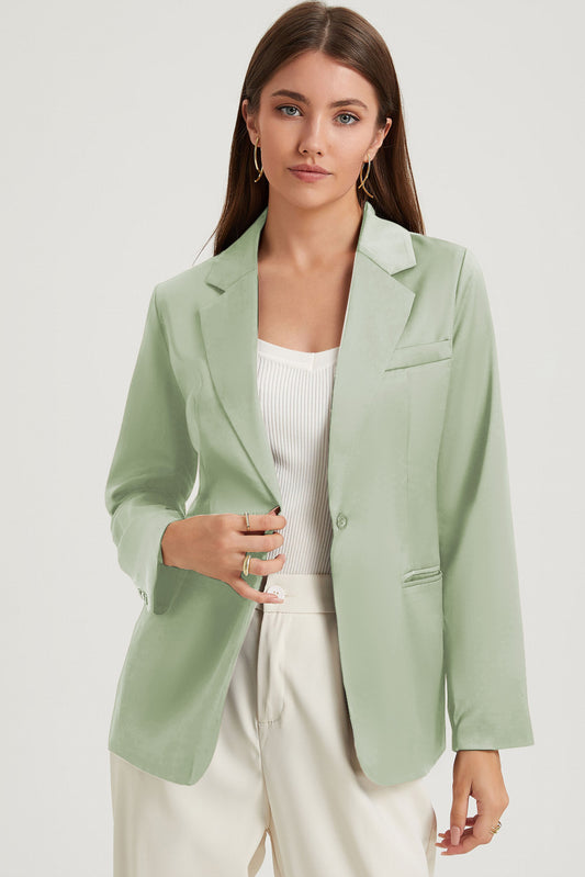 Groene blazer met enkele knoopsluiting en reverskraag