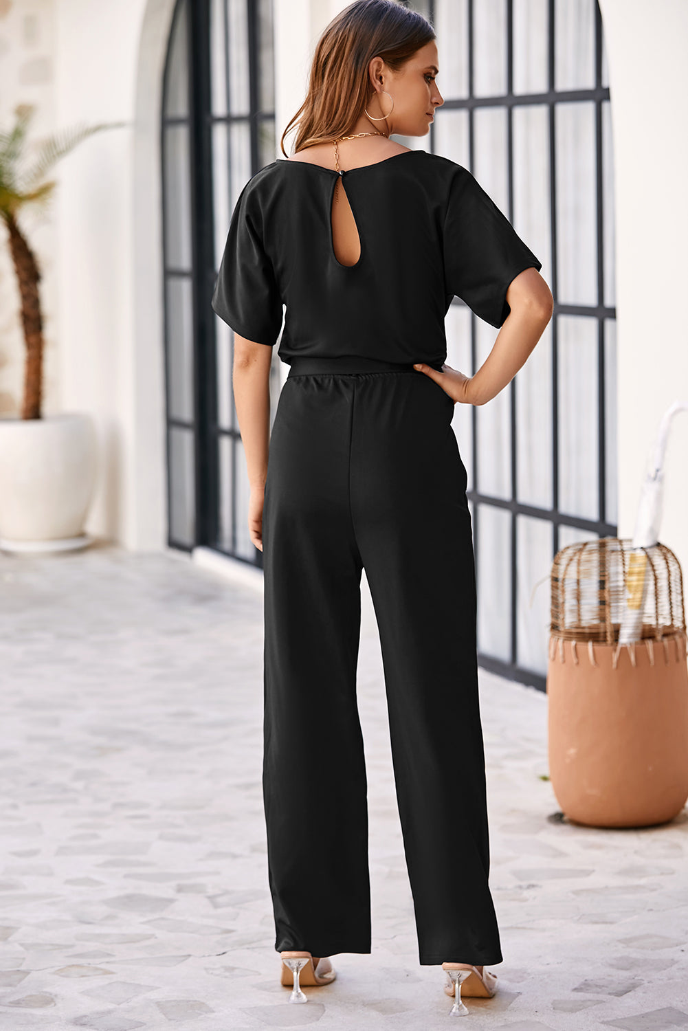 Blauwe jumpsuit met wijde pijpen en riem