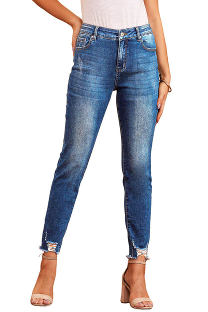 Blauwe skinny jeans met ruwe zoom tot op de enkel