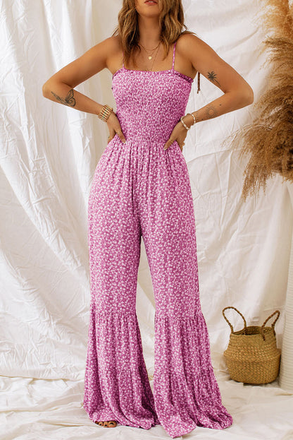 Zwarte dunne bandjes, gesmokt lijfje, wijde pijpen, bloemen jumpsuit