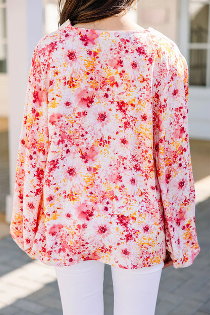 Roze blouse met bloemenprint en V-hals