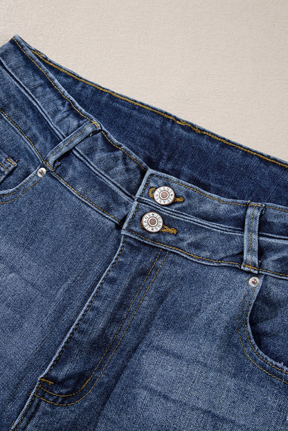 Hemelsblauwe jeans met hoge taille en gescheurde knopen