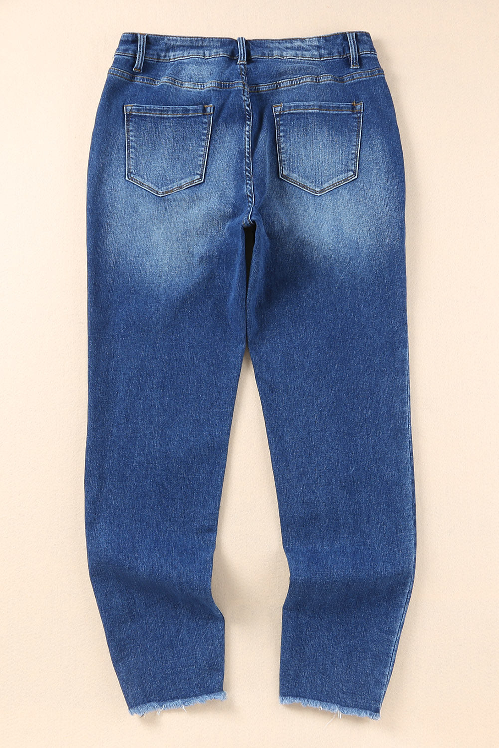 Blauwe skinny jeans met ruwe zoom tot op de enkel